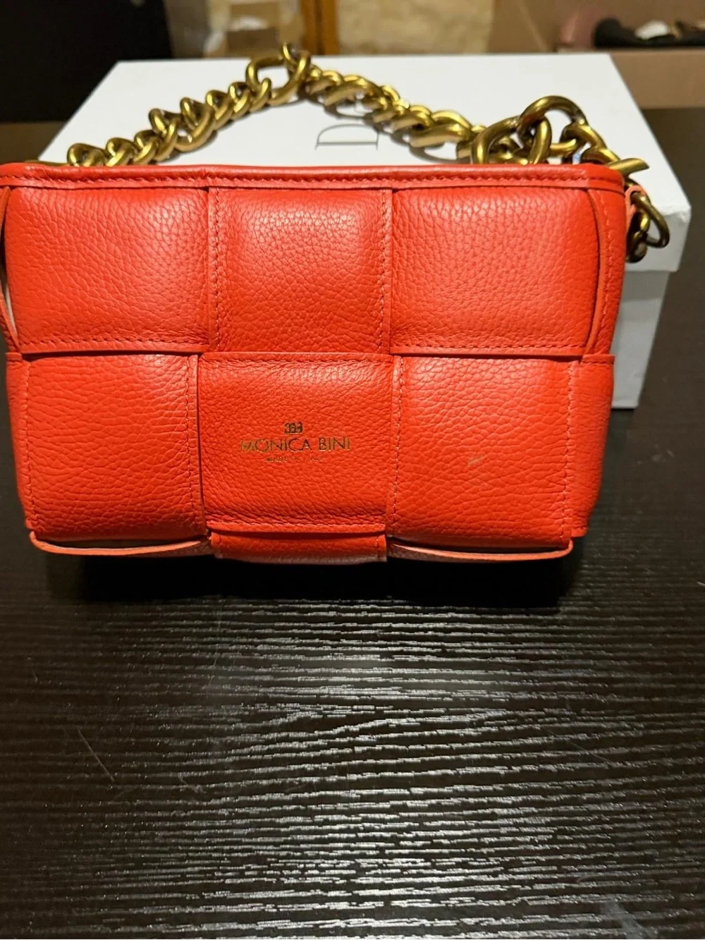 Monica Bini Orange pebbled small shoulder bag zip closure gold chain strap.